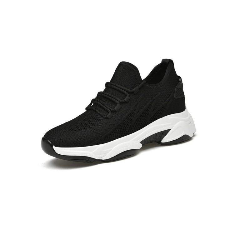 Schwarzer Sneaker mit weißer Sohle, atmungsaktives Mesh-Obermaterial, sportliches Design, ideal für Laufen und Freizeit, modischer Sportschuh.