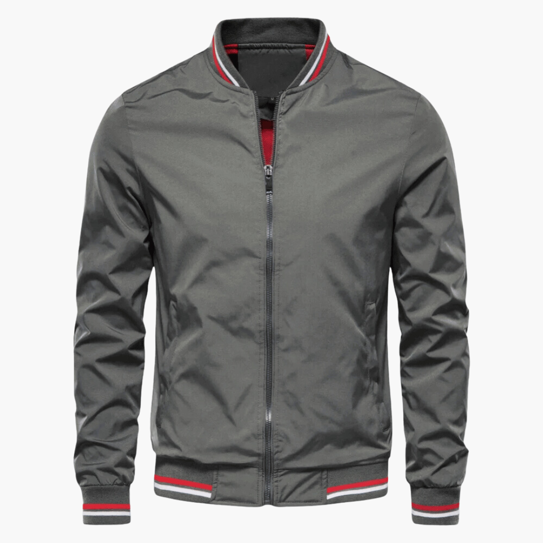 Graue Bomberjacke mit Reißverschluss, gestreiftem Kragen und Bündchen. Modische Herrenjacke, ideal für Herbst und Frühling.