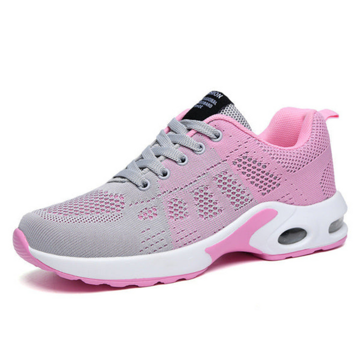 Grauer und rosa Damen-Laufschuh mit atmungsaktivem Mesh-Obermaterial, gepolsterter Sohle und sportlichem Design. Ideal für Fitness und Freizeit.