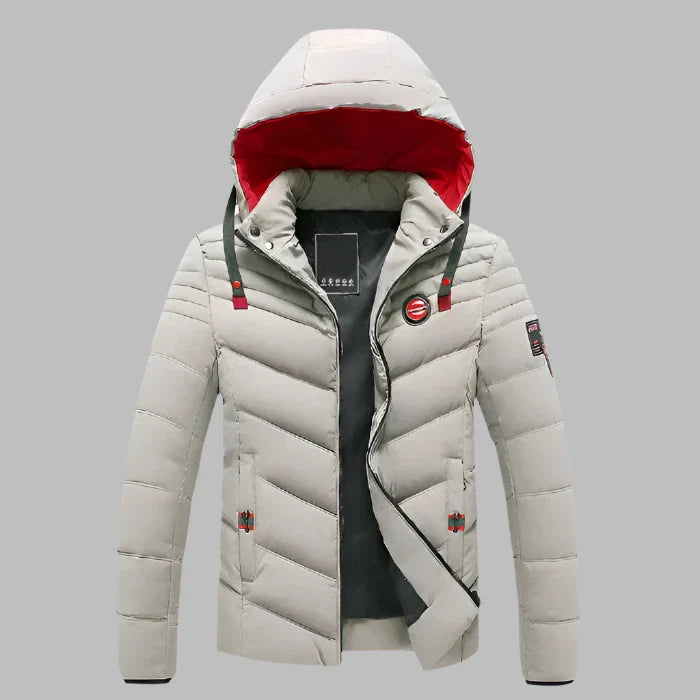 Graue Herren-Daunenjacke mit Kapuze, rotem Innenfutter und Reißverschluss. Winterjacke, warm, stilvoll, ideal für kaltes Wetter.