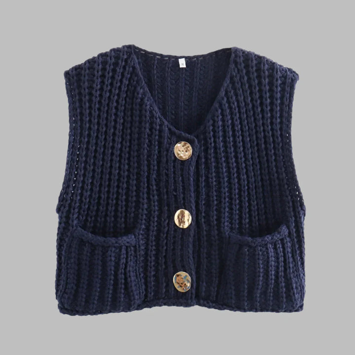 Dunkelblaue Strickweste mit drei goldenen Knöpfen und zwei Taschen, ärmellos, modisches Design, ideal für Herbst- und Winteroutfits.