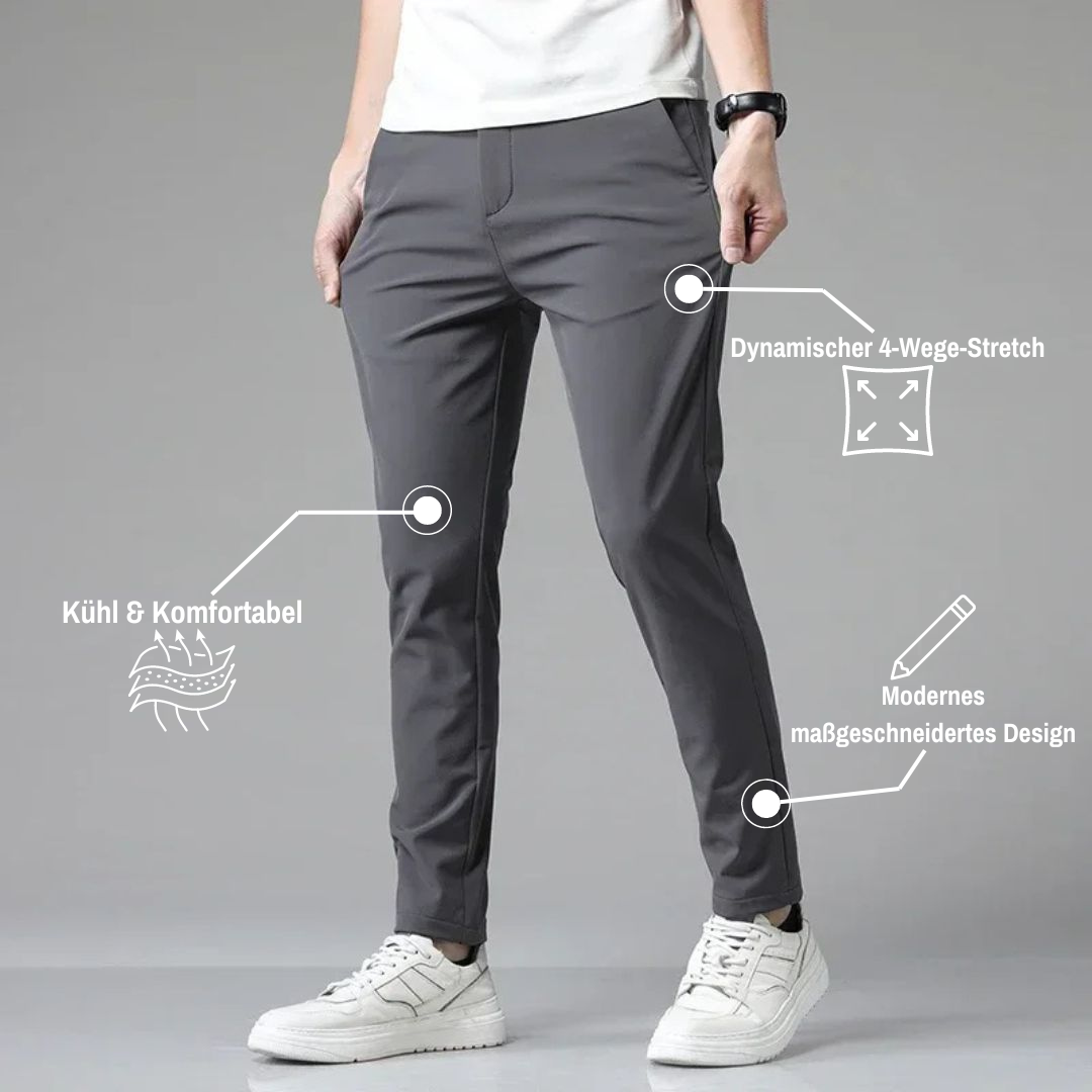 Mann trägt graue, moderne Hose mit dynamischem 4-Wege-Stretch, kühl und komfortabel, maßgeschneidertes Design, weiße Sneaker.