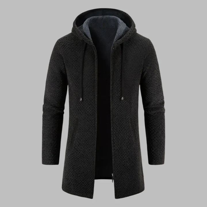 Schwarzer Herrenmantel mit Kapuze, Reißverschluss und Taschen, stilvoll und warm, ideal für Herbst und Winter. Hochwertige Herrenmode.