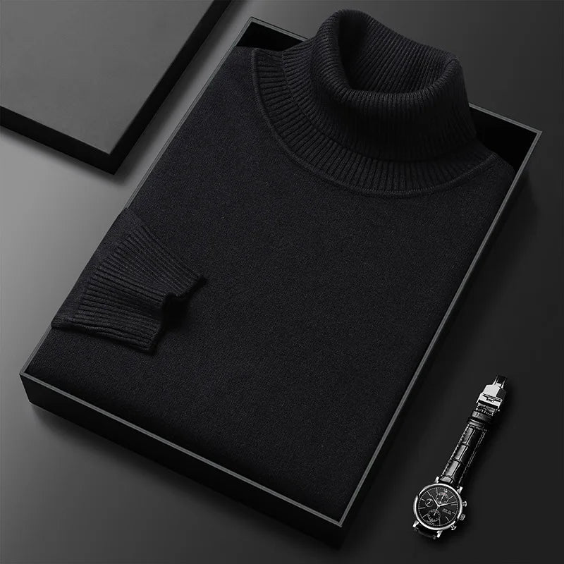 Schwarzer Rollkragenpullover in Geschenkbox, elegant gefaltet, neben einer stilvollen Armbanduhr. Hochwertige Mode, zeitloses Design.