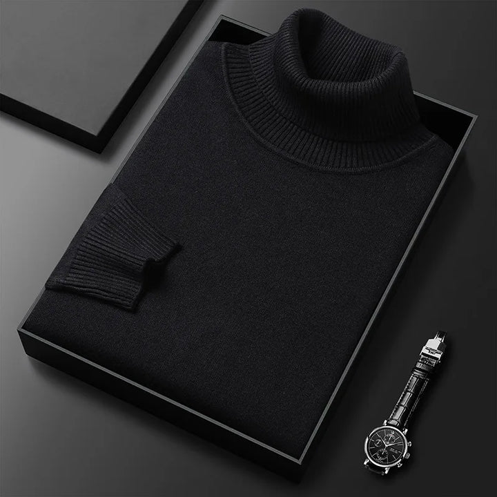 Schwarzer Rollkragenpullover in Geschenkbox, elegant gefaltet, neben einer stilvollen Armbanduhr. Hochwertige Mode, zeitloses Design.