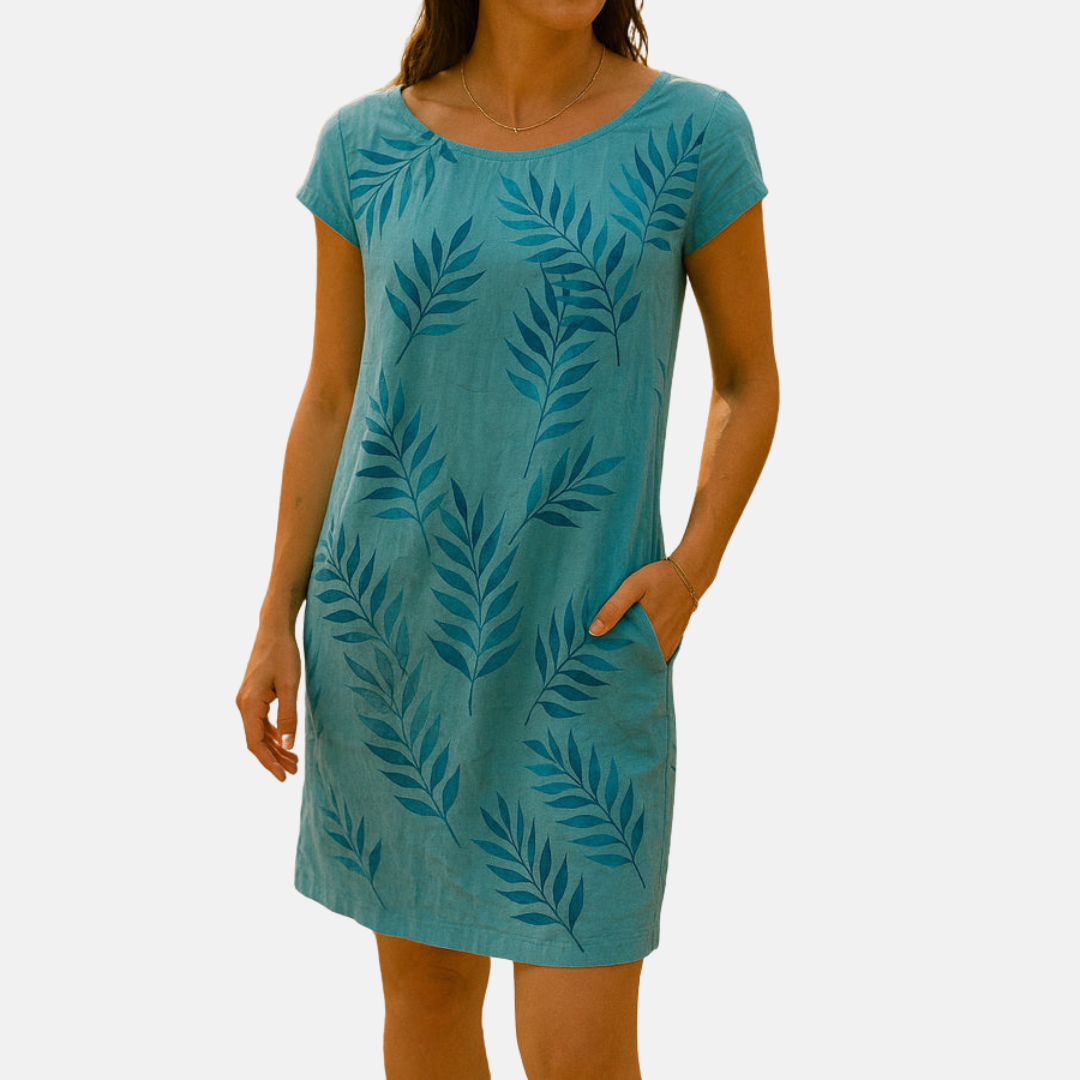 Damen Sommerkleid in Türkis mit Blattmuster, kurzärmelig, knielang, aus leichtem Stoff. Perfekt für Freizeit und Strand.