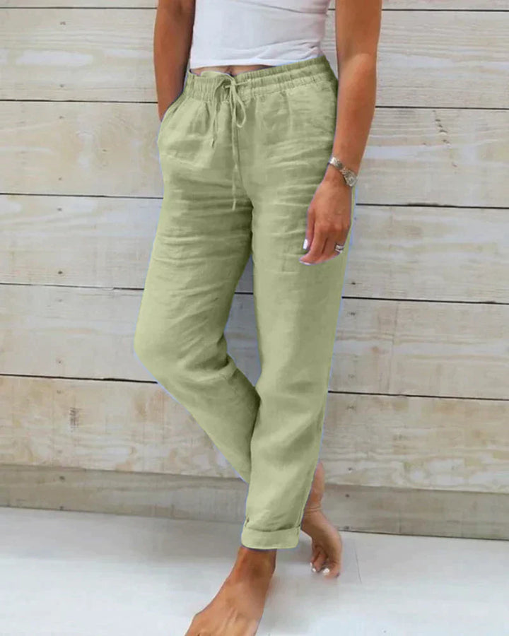 Damen Leinenhose in Hellgrün, lässig und bequem, mit Kordelzug und Taschen, ideal für Sommermode und Freizeitkleidung.