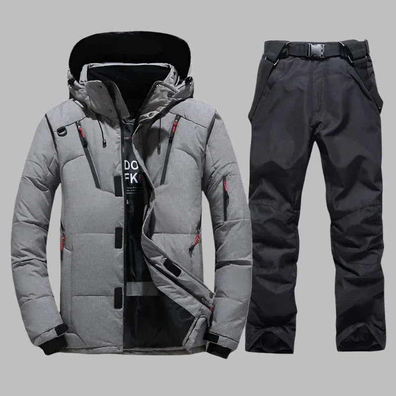 Graue Winterjacke und schwarze Skihose für Herren, wasserdicht und winddicht, ideal für Outdoor-Aktivitäten und Wintersport.