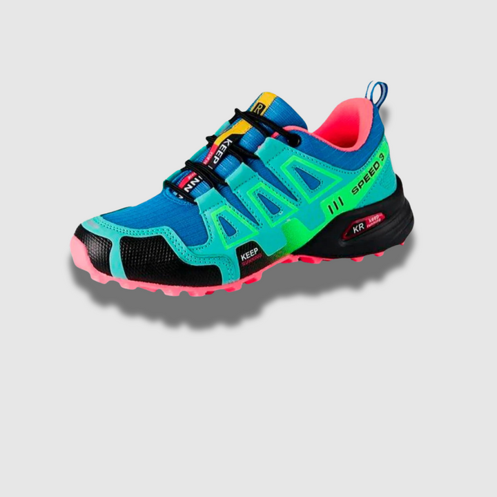 Bunter Trailrunning-Schuh mit blauen, grünen und pinken Akzenten, robustem Profil und atmungsaktivem Material. Ideal für Outdoor-Aktivitäten.