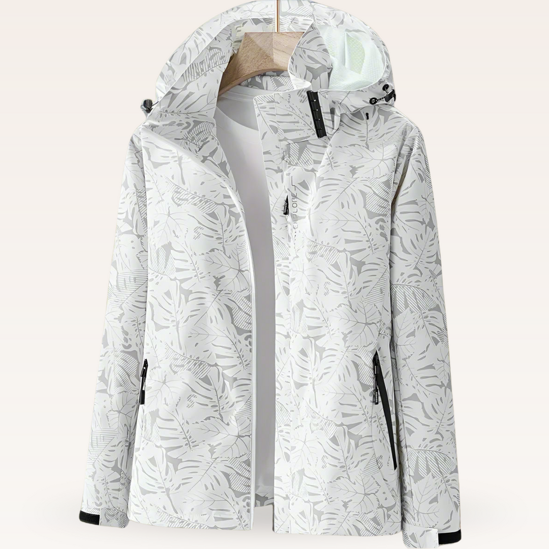Weiße Damenjacke mit Kapuze und floralem Muster, wasserdicht, winddicht, ideal für Outdoor-Aktivitäten, Reißverschlusstaschen, stilvoll und funktional.