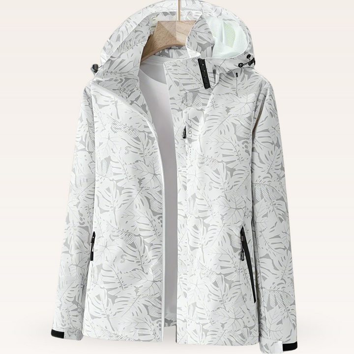 Weiße Damenjacke mit Kapuze und floralem Muster, wasserdicht, winddicht, ideal für Outdoor-Aktivitäten, Reißverschlusstaschen, stilvoll und funktional.