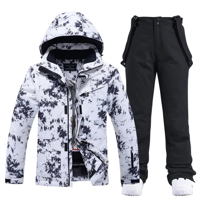 Weiße Skijacke mit schwarzem Muster und schwarze Skihose, ideal für Wintersport. Wasserdicht, atmungsaktiv, modisch. Perfekt für Skifahren und Snowboarden.