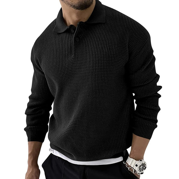 Schwarzer Herrenpullover mit Kragen, strukturiertem Strickmuster und langen Ärmeln. Modischer Look, ideal für Herbst und Winter.