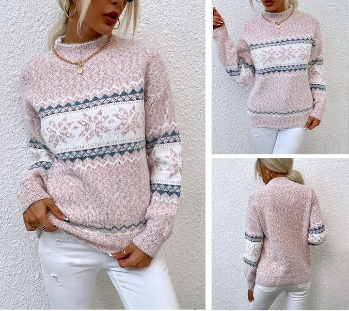 Dame in rosa Strickpullover mit Schneeflockenmuster, kombiniert mit weißen Jeans. Modetrend, Wintermode, gemütlicher Look.