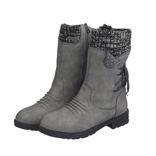 Graue Damenstiefel mit Strickbündchen, Reißverschluss und Zierschleifen. Modische Winterstiefel, ideal für kalte Tage. Bequeme, warme Schuhe.