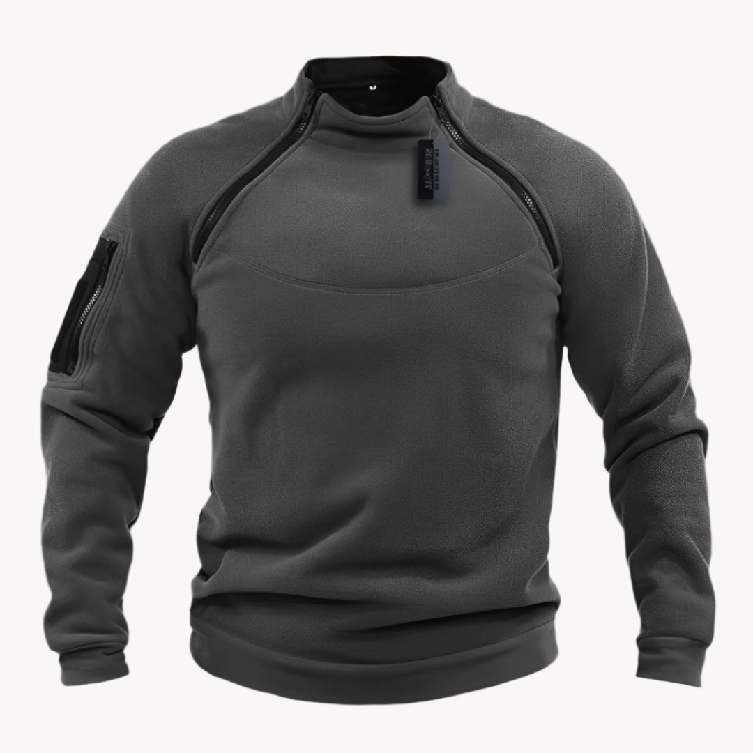Grauer taktischer Pullover mit Reißverschlüssen und Armtasche, ideal für Outdoor-Aktivitäten. Hochwertiges Material, perfekt für Herbstwetter.