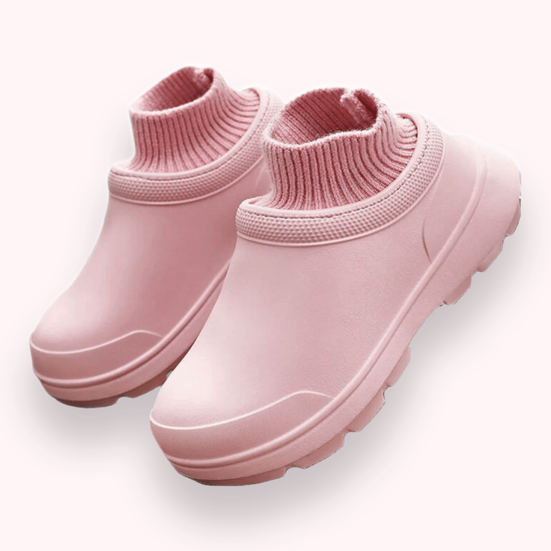 Rosa Gummistiefel mit gestricktem Schaft, modisch und wasserdicht, ideal für Regenwetter. Damenstiefel, bequem und stilvoll.