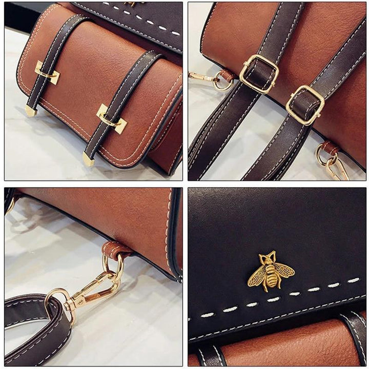 Braune Ledertasche mit goldenen Schnallen, Bienen-Emblem und schwarzen Riemen. Hochwertige Handtasche, stilvolles Design, modisches Accessoire.